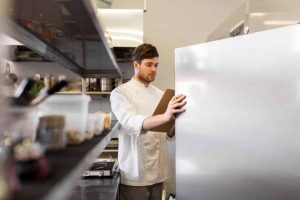 chef opening refrigerator door