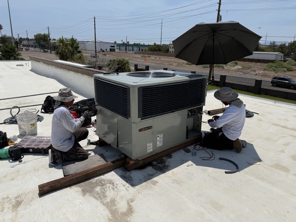 Legacy A/C technicians installing new unit